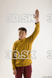 Arm flexing reference of yellow sweater red trousers Sidney 0005